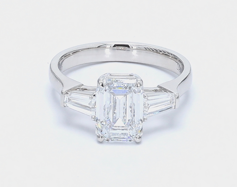 2.21 ct. Center Emerald Stone With 2 Trapezoid Side Stone Engagement Ring
