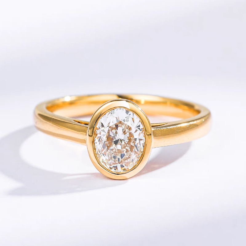 Oval Cut Solitaire Bezel Setting Engagement Ring With Plain Polished Band