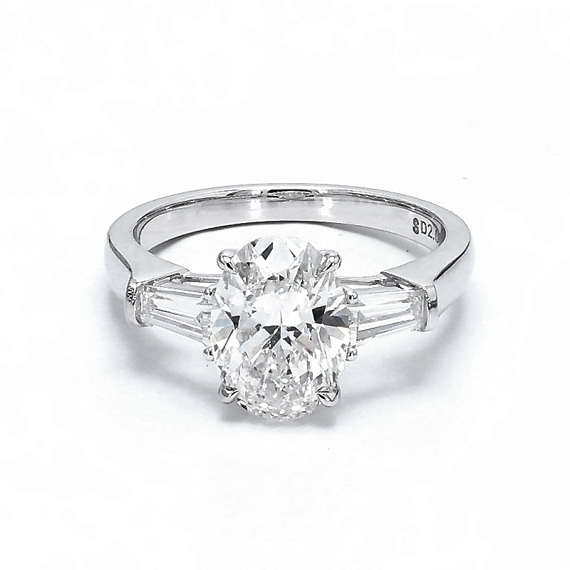 2.575 ct. tw. Oval Cut Center Stone & 2 Emerald Side Stones Engagement Ring